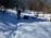 The path curves towards the north-east part of the hill. The snow here really slows us down and drains our energy.